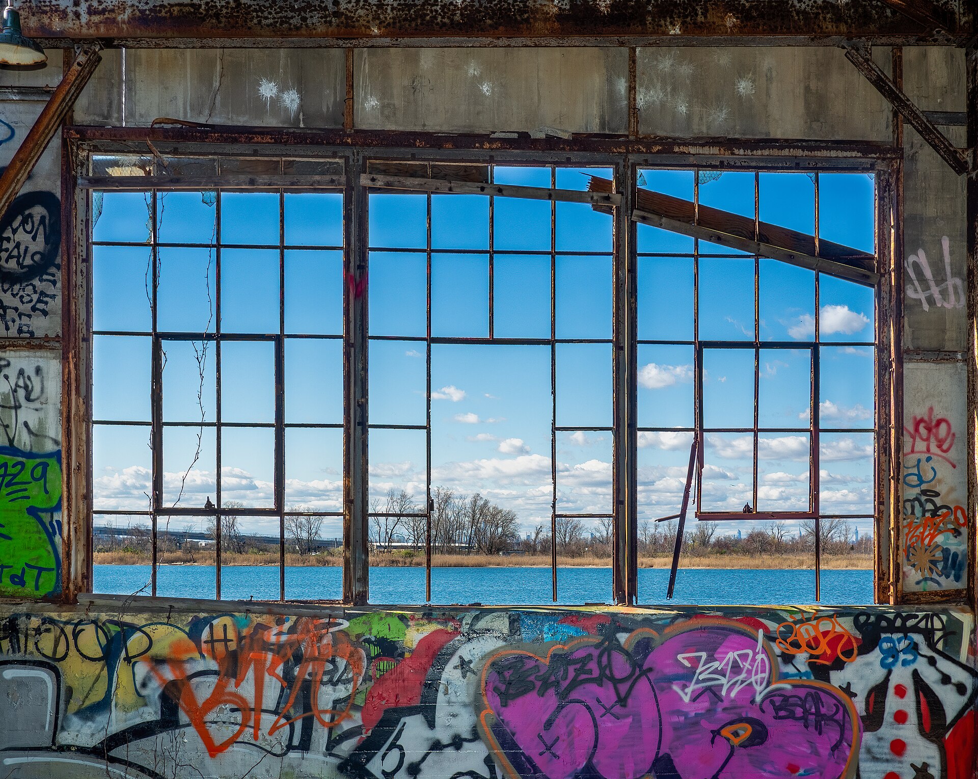 Derelict Building | Movies Fan Club A derelict building window frames a waterfront view, evoking the atmosphere of classic films.